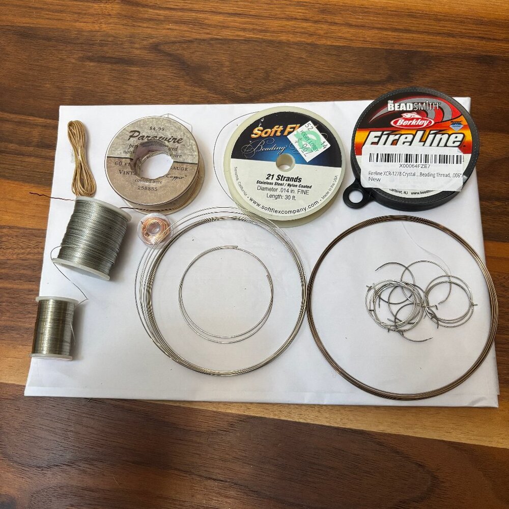 Lot of beading and jewelry wire in multiple types and sizes